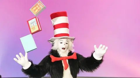 Chris Haston/WBTV via Getty Images A person dressed Cat in the Hat character 